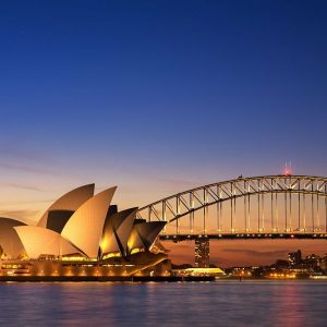 Sydney, Australia - September 5, 2013: Beautiful Opera house view at twilight time with vivid sky and illumination on the bridge.
